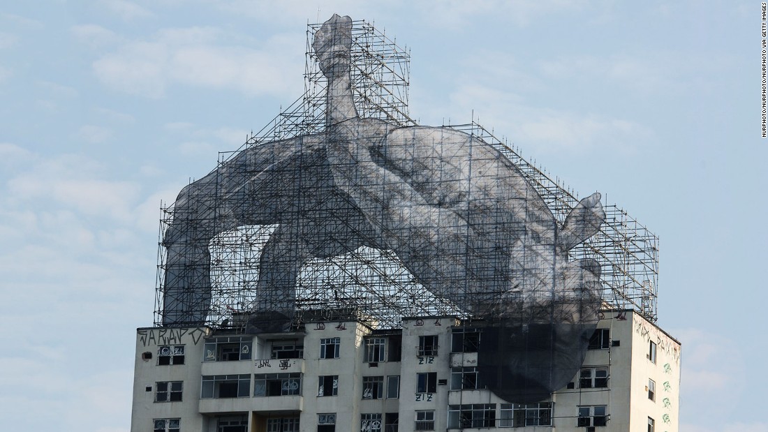 Giant figures take over the city for the Olympic Games